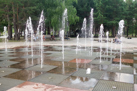 Dancing fountains in the city park in summer.の写真素材