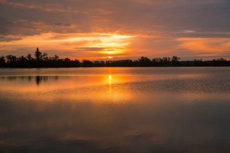 Sunset by the lakeの写真素材