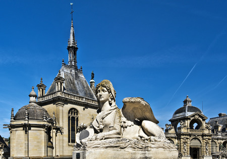 Chimera statue in entrance to Chantilly castle architectural details of the castle are at backgroundのeditorial素材