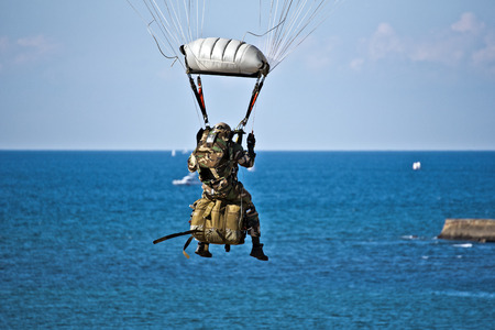 Saint-Jean-de-Luz, France, October 3, 2015 The French Air Force of parachutist During famous demonstration in the sky of Saint Jean de Luz Bay, the ocean out of focus background and sky are atのeditorial素材