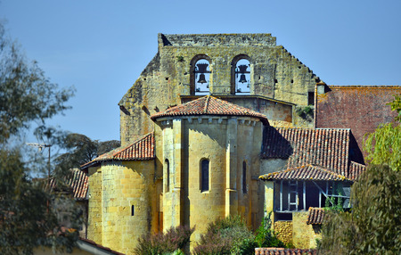 Main building of collegiate Pimbo in focus with Bell tower seen from the Village, its a course is Camino de Santiago pilgrimage, Situated in Tursan area overlooking Gabas valley in Landes, Aquitaine, Franceのeditorial素材