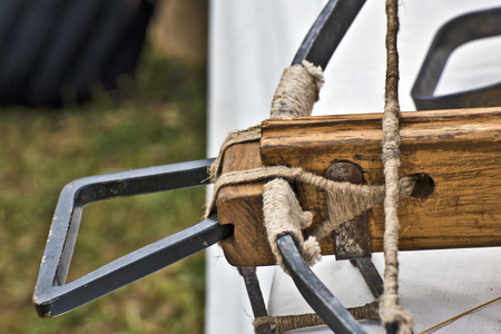 Arming hand and wooden holder of medieval crossbow