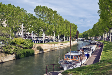 Narbonne, France May 4, 2016 Boats along the Canal de la Robine in Narbonne City, Languedoc-Roussillon Franceのeditorial素材