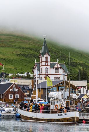 Husavik, Iceland - July 16, 2018 Husavik Port Departure from the Skyline at Skjalfandi Bay. North coast of Iceland, Nordurting municipality.のeditorial素材