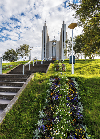 Akureyrarkirkja church viewed from Kirkjutroppurnar walk steps in Akureyri town, the Capital of Nordurland eystra region in North of Iceland.の写真素材