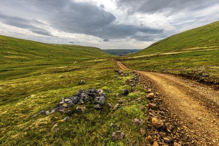 Laxardalsvegur road through the wild landscape of Vesturland region of Iceland. Dalabyggd...