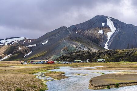 Fjallabak, Iceland July 21, 2018 Brennisteinsalda camping area in Landmannalaugar region of Fridland ad Fjallabaki Natural park in Highlands of Iceland. River of Jokulgilskvisl river is at foreground.のeditorial素材
