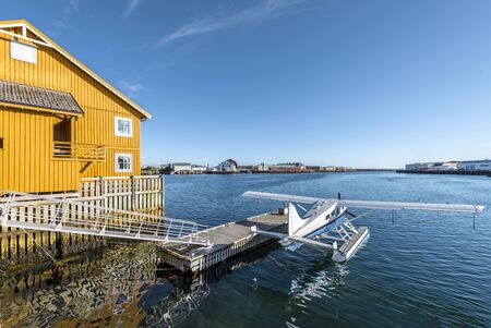 Hydroplane and wooden building in the islet of Lamholmen in the center of Svolvaer Town. Lofoten...