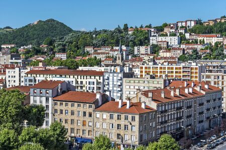 Saint-Etienne, France- July 29, 2019 Saint Stephen cityscape as seen from the tower of Cite Design in western direction. The Montaud hill is at background.のeditorial素材