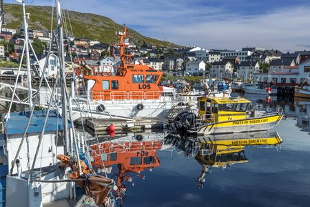 Honningsvag, Norway - August 10, 2017 The harbor view of boats and Honningsvag cityscape in Mageroya island.  Nordkapp Municipality in Finnmark county.のeditorial素材
