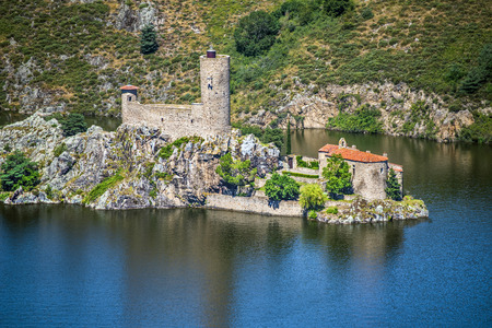 Ruines of the old castle and medieval chapel in the Grangent island. Gorges de la Loire, Saint Etienne region, France.のeditorial素材