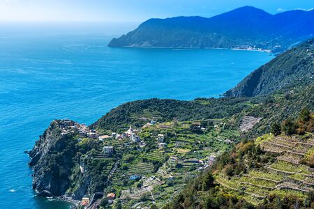 Cinque Terre coastal area around Corniglia Village as seen from the trail, the Cape Punta Mesco is...