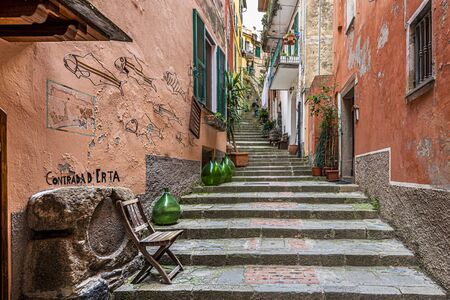 The arrow passage with steps in ancient village of Monterosso al Mare in Cinque Terre coastal area. Liguria region in Italy.の写真素材