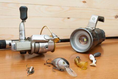 a set of fisherman on a wooden backgroundの写真素材