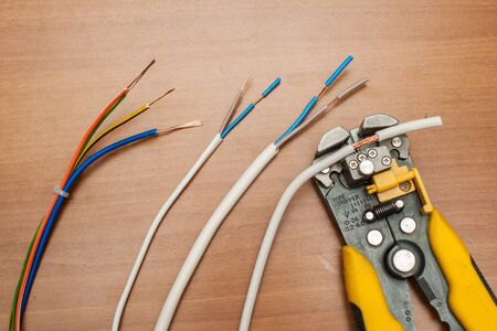 wire stripper and pliers  and cable ferrules ready to applyの写真素材