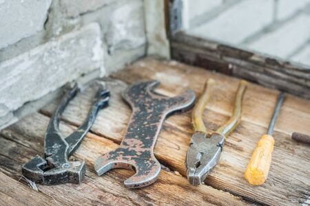 Old tools lie on the boards on the balcony