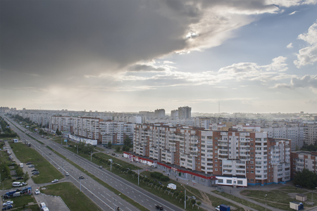 Urban landscape with a view of the avenue tratorostroiteley with the storm cloud before a strong thunderstorm. Horizontal frame. City Cheboksary, Chuvash Republic, Russia. Travel Russia. 05/04/2016のeditorial素材