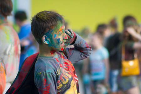The boy in the blue shirt. The festival of colors Holi in Cheboksary, Chuvash Republic, Russia. Holiday joy. 05/28/2016のeditorial素材