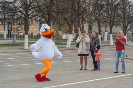Man in suit dancing duck on the red square of Cheboksary, Chuvash Republic, Russia. May 1, 2016のeditorial素材
