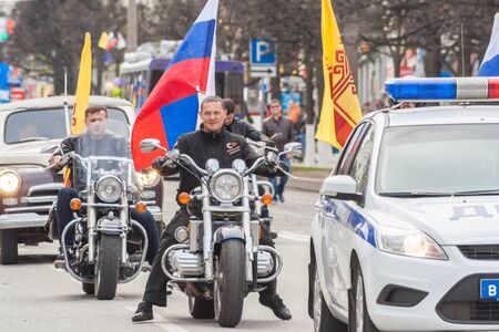 The procession, parade May 1, 2016 in the city of Cheboksary, Chuvash Republic. Russia. Bikers motorcycle club Night Wolves. Car road patrol sludby. Police.のeditorial素材