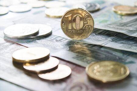 Russian coins on the background of paper banknotes Russian bank.の写真素材