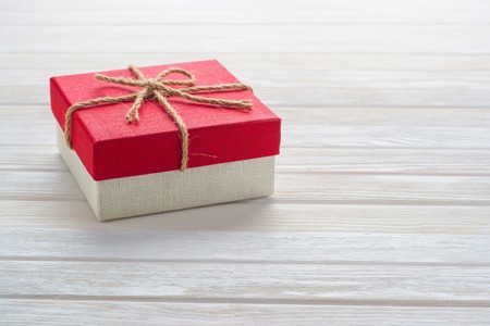 Gift box on a white wooden background.の写真素材