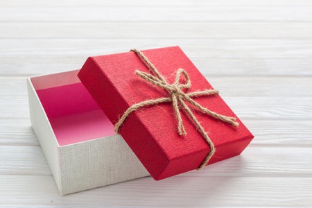Gift box on a white wooden background.の写真素材