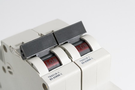 Circuit breakers on a white table.の写真素材