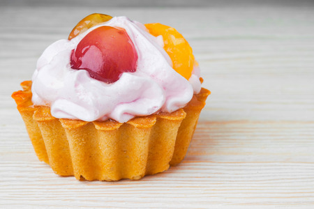 cake basket on an old wooden table.の写真素材