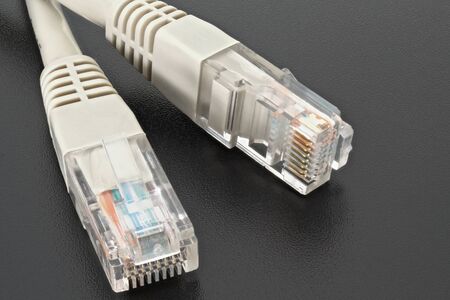 Stacked macro of ethernet cable on black background