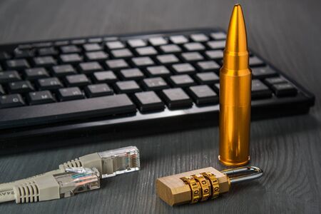 concept attacks Internet. keyboard with network cable. attack on encryption.の写真素材