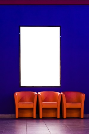 Advertising banner on the wall near the chairs in the cinema.の写真素材