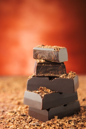 Chocolate bars on a wooden background. Chocolate candies.の写真素材