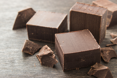 Dark chocolate on a wooden backgroundの写真素材