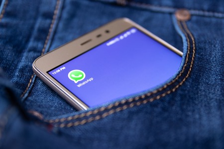 Whatsapp icon on smartphone screen in jeans pocket. Cheboksary, Russia, 02/17/2019のeditorial素材