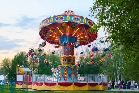 People ride the chain carousel in an amusement park. Cheboksary, Russia, 05/11/2019のeditorial素材