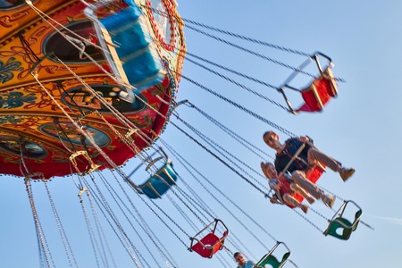 People ride the chain carousel in an amusement park. Cheboksary, Russia, 05/11/2019のeditorial素材