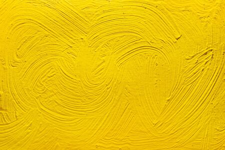 Abstract yellow background from acrylic paints. Concrete background.の写真素材