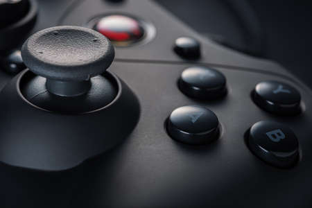 The arrow buttons of a black game controller. Game development. Retro video games. Game consoles.