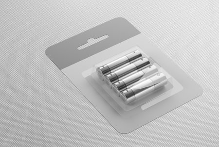 Set of AA batteries on a white background. Place batteries in a cardboard box on a table. 3d rendered.の写真素材