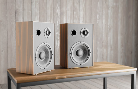 Wooden music speakers stand on the table against the background of a wooden interior. 3d rendering.の写真素材