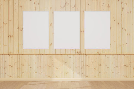 Models of paintings, posters, photographs. Three empty wooden photo or picture frames hang on a wooden wall. Design template for layout. 3D rendering.の写真素材
