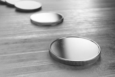 Silver coins without lying on a metal table. The concept of donations, savings. 3d rendering.の写真素材