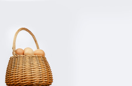 A close up of a wicker basket with eggs. High quality photoの写真素材