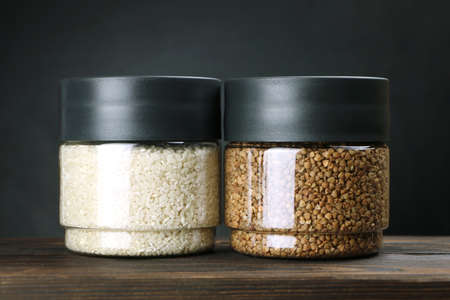 Storing cereals in the kitchen in a transparent container on a dark background