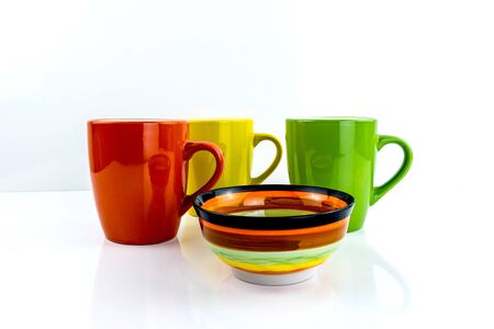 Colorful mugs on  background   . Ceramic coffee cup for montage or design.Isolate, horizontal view.の写真素材