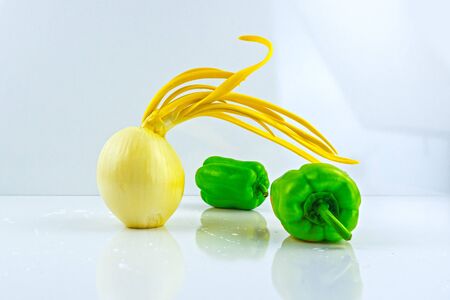 Fresh vegetables isolated on a white background.Onion,red and green pepper,cabbage,carrotの写真素材