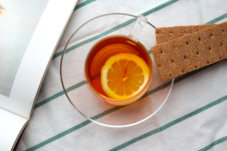tea with lemon on the table in the morning