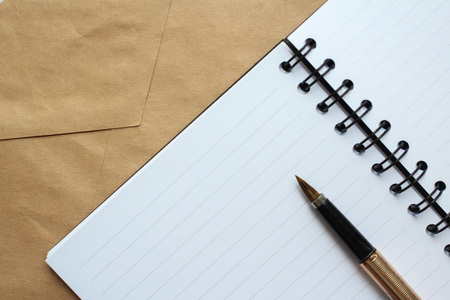pen, notebook and envelope