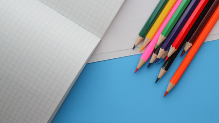 pencils on the notebookの写真素材